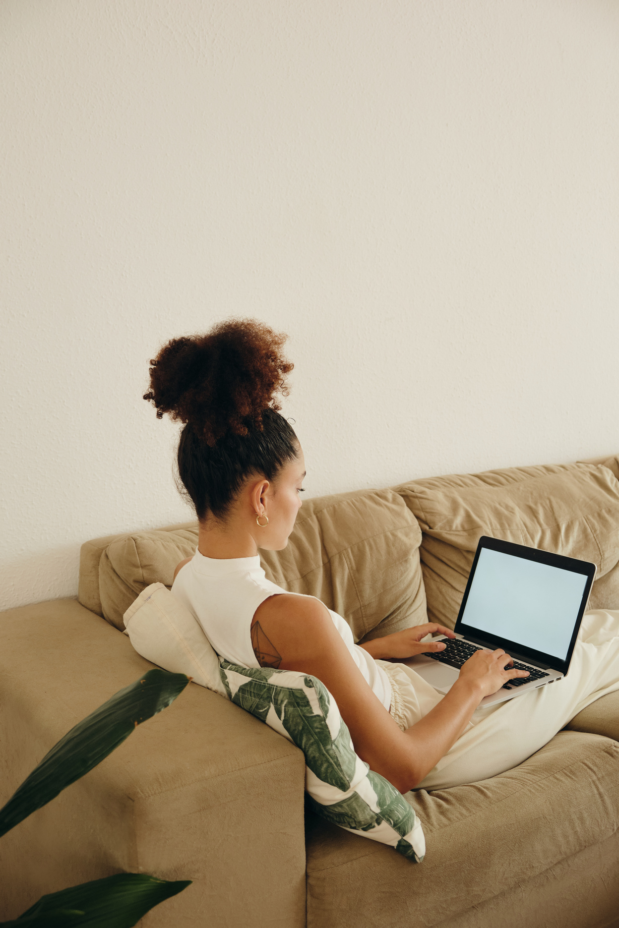 Businesswoman Working on a Laptop on the Sofa